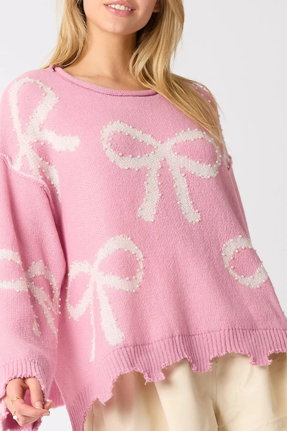 Pull à ourlet fendu en détresse à motif de nud perlé rose